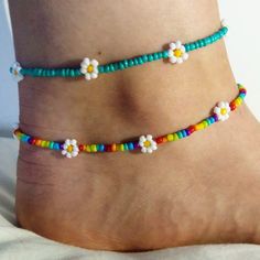 Dainty daisy anklet/ summer anklet/dainty anklet/ rainbow anklet/ rainbow anklet/ trendy jewellery/ cute boho jewellery/ dainty jewelry. Very fragile but beautiful as long as you're careful! Perfect gift for family or friends, or just something for yourself! To measure your anklet size, I suggest taking a piece of string (or a tape measure if you have one) and then measure around your ankle and choose the closest (or slightly larger) option!  If there are any problems please let me know on here or on my Instagram: @lanneaux_jewellery! Spring Anklets With Colorful Beads, Adjustable White Anklets For Spring, Adjustable Dainty Anklets With Colorful Beads, Dainty Adjustable Anklets With Colorful Beads, Trendy Summer Anklets With Round Beads, Handmade Trendy Anklets For Spring, Adjustable Anklets For Spring Gift, Trendy Handmade Anklets For Spring, Handmade White Anklets For Summer