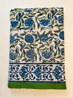 a blue and white cloth with flowers on it