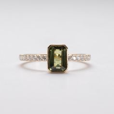 Metal: 14k yellow gold Stone: Natural Green Sapphire Stone size: 1 carat Stone Shape: Emerald Cut Accent Stones: Natural Diamonds Band Width: 1.6mm Emerald Cut Band, Australian Sapphire, Parti Sapphire, Green Sapphire Ring, Green Gemstone Ring, Saphir Ring, Teal Sapphire, Sapphire Diamond Ring, Green Sapphire