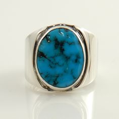 You are looking at a handcrafted sterling silver turquoise ring. The sterling silver has a nice polish with a great artistic look. This blue turquoise stone is from my Valley Blue turquoise collection. The simple silver handcrafted design wraps around the natural turquoise stone nicely. As you can see by the ring setting that this turquoise stone is set into a nice bezel setting. Ring Size: 8.25 (The top of the ring is 18mm wide and tapers down to 5mm wide) Turquoise stone size: 12mm x 15mm Ring Mens Turquoise Rings, Bezel Setting Ring, Silver Turquoise Ring, Silver Turquoise Jewelry, Natural Turquoise Stone, Sterling Silver Rings Turquoise, Turquoise Ring Silver, Sterling Silver Mens, Tucson Az