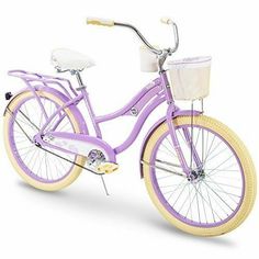 a purple bicycle is shown with a basket on the front and back tire rims