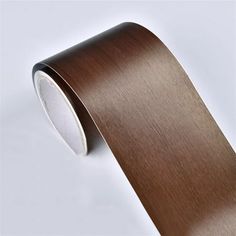 a roll of brown tape on a white background