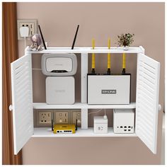 an open shelf with various electrical devices on it