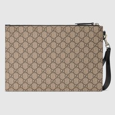 Description A pouch crafted from beige and ebony GG Supreme canvas. Completed by a leather trim, the accessory features the Kingsnake—a symbol thought to represent wisdom and power. Size: 12″ x 8″ x 0.5″ Inches / 30 x 21 x 1.5 CM 100% genuine leather, matching the quality of the Gucci product; Beige/ebony GG Supreme canvas, a material with low environmental impact Black leather trim Kingsnake print Four clots Interior open pocket Cotton linen and moiré lining Removable leather wrist strap Zipper Pouch Craft, Gucci Gifts, Women Sunglasses, Carry All Bag, Hermes Bags, Gucci Handbags, Environmental Impact, Fendi Bags, Wrist Strap