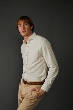 Introducing the Woven Oxford Shirt in Tan and Off White - a timeless and versatile addition to any wardrobe. Crafted using 100% organic cotton fabric, this shirt is lightweight and breathable, ensuring maximum comfort throughout the day. The subtle tan hue with off-white gives it a classic and sophisticated textural look, while the imitation mother-of-pearl buttons lend a touch of luxury to the overall design. This shirt has been exquisitely crafted to ensure a comfortable fit, making it perfect Cream Cotton Button-up Shirt, Beige Spread Collar Shirt For Everyday, Everyday Beige Shirt With Spread Collar, Beige Everyday Shirt With Spread Collar, Daily Beige Shirt With Spread Collar, Cream Cotton Shirt With Spread Collar, Beige Button-up Shirt For Casual Gatherings, Beige Cotton Shirt For Business Casual, Timeless Long Sleeve Cotton Shirt