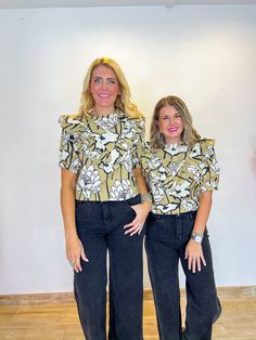 Meet your new office MVP: the Blooming Magnolias Blouse! This chic and airy top effortlessly transitions from your 9-to-5 to a lively evening out. With its sophisticated neutral hues and fluttery ruffle details, it’s like a breath of fresh air for your work wardrobe. Style it with sleek black jeans for a polished look or dress it up with a statement necklace for a touch of evening glam. Crafted from lightweight fabric with a true-to-size fit, it’s as flattering as it is versatile. PRODUCT FIT - Chic Summer Office Tops, Trendy Floral Print Top For Office, Spring Office Beige Blouse, Trendy Floral Print Office Tops, Chic Spring Office Top, Trendy Office Tops With Floral Print, Chic Floral Print Office Tops, Versatile Beige Office Tops, Beige Tops For Night Out In Spring