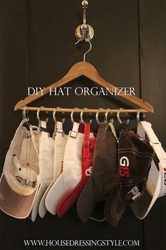 a rack with hats hanging from it's hooks and the words diy hat organizer above it