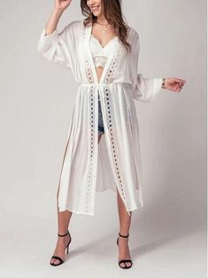 Add a touch of boho chic to your wardrobe with this kimono style cardigan. The front lace detail adds a touch of femininity and the long, flowy fit is perfect for a day at the beach or pool. This versatile piece can be worn as a cover up for your swimsuit, or as a festive addition to your outfit for a spring or summer party. Take it on your next resort vacation for a touch of bohemian flair. This kimono cardigan is the ultimate beach boho accessory Small (2/4), Medium (6/8), Large (10) Maxi Card Chic Lace Cover-up For Beach Season, Bohemian Spring Brunch Cover-up, Spring Beach Party Cover-up With Crochet Trim, Bohemian Lace Patchwork Summer Cover-up, Spring Festival Lace Cover-up, Flowy V-neck Cardigan For The Beach, Chic Lace Trim Beach Cover-up, Hippie Style Cover-up For Spring Beach Party, Lace Open Front Cover-up For Summer