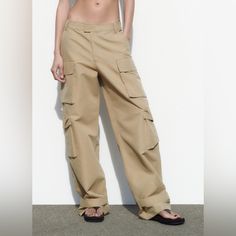 -Taupe Brown -Unworn -New With Tags Beige Wide Leg Utility Pants, Beige Wide-leg Utility Bottoms, Beige Wide-leg Utility Pants, Beige High-waisted Utility Pants, Neutral Wide Leg Pants With Side Pockets, Beige Cargo Bottoms For Fall, Beige High-waisted Wide Leg Utility Pants, Beige Utility Trousers, Beige Wide-leg Pants With Cargo Pockets