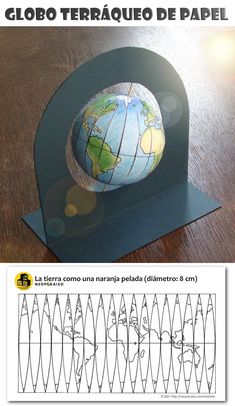 a paper model of the earth on top of a wooden table