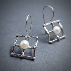 Bridal Pearl Earrings 925. Very elegant geometric earrings made out of Silver 925 and natural freshwater Pearl. You can choose between two different sizes.  If you want to make them a set, here is the matching pendant: https://www.etsy.com/listing/258712074/silver-handmade-pendant-with-pearl?ga_search_query=pendant%2Bsquare&ref=shop_items_search_2&frs=1 Details: Material: Sterling Silver 925 and Pearls 5 mm diameter (0.2 inch) Width: 16mm (5/8 inch) Length: Choose between two options A 35mm (1 3 Modern Pearl Earrings With Ear Wire As Gift, Modern White Gold Pearl Earrings In Sterling Silver, Modern White Gold Sterling Silver Pearl Earrings, Sterling Silver Pearl Dangle Earrings, Modern Round Sterling Silver Pearl Earrings, Modern Silver Pierced Pearl Earrings, Modern Sterling Silver Pearl Earrings For Gift, Modern Sterling Silver Pearl Earrings As Gift, Modern Sterling Silver Earrings As Gift