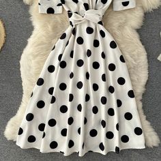 Cute polka dot v neck short dress fashion dress Fabric: blended Color: black, white Size(cm): S, M, L, XL S length 105 bust 80 waist 68 M length 106 bust 84 waist 72 White V-neck Short Sleeve Party Dress, White Short Sleeve V-neck Party Dress, White V-neck Party Dress With Short Sleeves, Chic A-line Polka Dot Dress, Trendy White A-line Dress, Summer V-neck Polka Dot Midi Dress, Trendy Polka Dot Dresses For Summer, Trendy Polka Dot Summer Dress, Casual Polka Dot V-neck Midi Dress