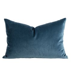 a blue pillow on a white background