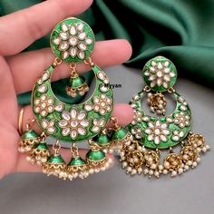 Sabyasachi inspired  green kundan chandbali jhumka earring in emerald green color. Inspire your style with bollywood style trendy oversized statement chandbali earring in gold finish with kundan and pearl details.   All orders Ship same day if placed before 4:00 PM EST  Earring Length: 3.5 inches Earring Width: 1.8 inches Create beautiful memory for any occasion with elegant jewelry for your loved ones We will be happy to navigate you through the process so if you have any questions regarding our product before placing an order reach out to us and we will be there to help you.  Thank you for your visit and support Kundan Chandbali, Chandbali Earrings, Emerald Green Color, Pearl Details, Bollywood Style, Jhumka Earrings, Drop Earring, Bollywood Fashion, Elegant Jewelry