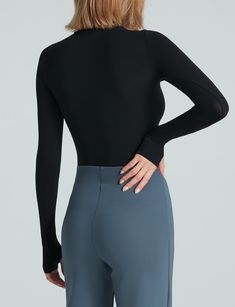 Made from a matte-black, seamless microfiber with endless stretch, our Ballet Turtleneck Long Sleeve Top features thumbhole details and bonded edges for a sleek finish. Will be on high rotation. Product Details    Luxury microfiber blend (84% nylon, 16% elastane)   Fit-tested by real women  One size fits most  Four-way stretch and high recovery  High fabric breathability  Snap closure gusset   Machine washable   Item KT071 Solid Activewear With Thumbholes And 4-way Stretch, Versatile Activewear With Thumbholes, Versatile Solid Activewear With Thumbholes, Solid Activewear With Thumbholes In Elastane, Stretch Activewear With Thumbholes, Nylon Activewear With Thumbholes, Solid Nylon Activewear With Thumbholes, Solid Compressive Activewear With Thumbholes, Micro-elastic Solid Tops For Workout