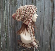 "Style: Charlotte - a slouchy beanie pom pom hat. Color: This sample hat is shown in Jam Cookie, tan mixed with cherry red, eggplant and slate grey. Sizes: One size fits average teen or adult head size of 20\" to 23\" (50.5 cm to 58 cm). Fiber Content: 80% acrylic, 20% Wool Characteristics: Chunky, very soft, warm and cozy. Care Instructions: Hand wash, dry flat. Every item from Pixiebell is handmade and knit or crocheted to order, unless otherwise stated in title of the item as \"ready to ship\ Bohemian Hand Knitted Winter Beanie, Bohemian Knitted Hats For Cold Weather, Bohemian Style Hats For Cold Weather, Bohemian Brimmed Beanie For Winter, Beanie Pom Pom, Fall Fashion Accessories, Hat Pom Pom, Girlfriends Day, Chunky Knit Hat