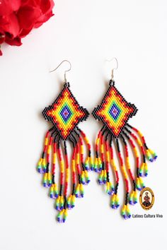 These Beaded Mexican Earrings are so colorful and perfect for all-day wear. They are definitely the perfect accessory to style up your look and add personality to your outfit. These lovely handmade beaded earrings are made with sterling silver hooks and high-quality colorful beads. The length of the beaded Earrings is approximate of 4 inches (10.2 cm) Each pair of earrings that we sell is authentic and one-of-a-kind! Traditional Multicolor Handwoven Earrings, Traditional Yellow Handwoven Beaded Earrings, Frida Beaded Earrings, Huichol Jewelry, Huichol Earrings, Handmade Beaded Earrings, Mexican Earrings, Native American Earrings, Boho Style Earrings