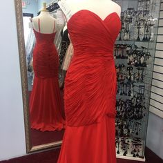 Red Dress Fit And Flair Elegant Red Ruched Gown, Red Evening Dress With Ruched Bodice For Prom, Red Formal Evening Dress With Pleated Bodice, Elegant Red Dress With Pleated Bodice, Red Evening Gown With Pleated Bodice, Red Evening Dress With Sweetheart Neckline, Elegant Red Gown With Fitted Bodice, Red Gown With Pleated Bodice For Evening, Red Sweetheart Neckline Evening Dress