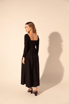 Expertly crafted for timeless elegance, the Galilea Dress in Black features a long sleeve and fitted top for a flattering silhouette. The square neckline adds a touch of sophistication while the full skirt and midi length offer versatile styling options for any occasion. Elevate your wardrobe with this must-have dress. The design process of Kleid is magic! Childhood best friends carefully review each detail to remain truthful to the reasons why they decided to embark in the adventure of reinvent Fall Black Dress With Straight Neckline, Black Fall Dress With Straight Neckline, Black Dress With Straight Neckline For Fall, Long Sleeve Ruched Midi Dress With Fitted Bodice, Ruched Long Sleeve Midi Dress With Fitted Bodice, Ruched Long Sleeve Maxi Dress With Fitted Bodice, Fitted Midi Dress With Straight Neckline For Fall, Long Sleeve Midi Dress With Fitted Bodice, Black Midi Dress With Fitted Bodice And Straight Neckline