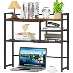 an open laptop computer sitting on top of a wooden shelf filled with books and other items