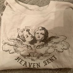 Not Cropped But Not Oversized Brandy Melville Heaven Sent T-Shirt Never Worn Oversized White Band Merch Top, White Print Crew Neck Band Merch Top, White Print Band Merch Crew Neck Top, Angel Heaven, Prey Animals, Brandy Melville T Shirts, Tshirt Collection, Space Sky, Brandy Melville Skirts