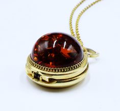 Vintage European gold tone & dome faux amber locket watch pendant necklace 199 Vintage European gold tone and dome faux amber locket watch pendant necklace, In good worked condition, The chain 17" long, Watch pendant  25 mm across 15 mm thick. Amber 20 mm across. Thanks, Collectible Gold Jewelry With Detachable Pendant, Gold Necklaces With Detachable Pendant For Collectors, Antique Gold Jewelry With Detachable Pendant, Gold Locket Necklace With Detachable Pendant For Formal Events, Gold Locket Necklace With Detachable Pendant For Formal Occasions, Amber Round Amulet Jewelry, Amber Amulet Round Jewelry, Gold-tone Round Locket Necklace, Amber Locket Jewelry For Gift