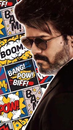 an image of a man with glasses and beard in front of comic book covers that say boom