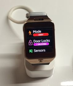 a smart watch sitting on top of a white table