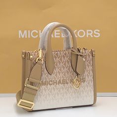 Michael Kors Mirella Extra-Small Ombr Logo Crossbody Xbody Shopper Bag Camel Nwt Authentic Whether You’re Heading To A Daytime Event Or Simply Running Errands, The Mirella Will Meet The Moment. Fit All Your Essentials Into This Charming Mini Tote, Which Can Be Carried By The Top Handles Or Worn Cross-Body Thanks To A Removable Strap. Printed With Our Initials In An Ombr Finish, It’s A Reliable Way To Spice Up Any Outfit. Crossbody Bag Logo-Print Canvas 90% Coated Canvas/10% Polyester Trim 1: 60% Beige Purses, Bag Logo, Convertible Crossbody Bag, Large Crossbody Bags, Bags Michael Kors, Brown Crossbody, Michael Kors Crossbody, Bags Logo, Chain Crossbody Bag