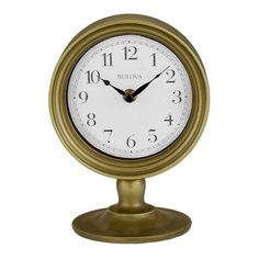 a gold clock on a white background