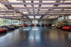 a large garage filled with lots of different colored cars