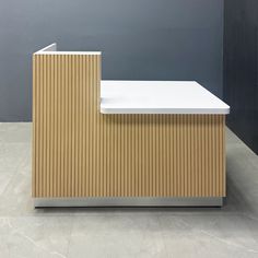 Introducing the Dallas ADA Reception Desk - 55 inches, a perfect blend of accessibility and style. Crafted with a combination of Plywood and MDF, this desk is designed for durability and elegance. The desk counter features a maple tambour finish, while the workspace is covered in a sleek white matte laminate. The toe-kick, made of brushed aluminum solid, adds a touch of modern sophistication. Built to commercial-grade standards, this reception desk ensures long-lasting quality. Designed and hand Drop Front Desk Bar, Concierge Desk Design, Ada Reception Desk, Custom Conference Table, Custom Reception Desk, Office Reception Area, Lobby Furniture, Modern Reception Desk, Lobby Seating