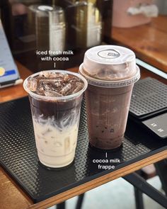 two drinks sitting on top of a table next to each other with information about the drink