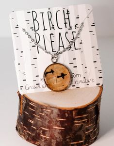 a piece of wood that has been placed on top of a tree stump with the words birch please