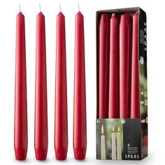 four red candles are in a box