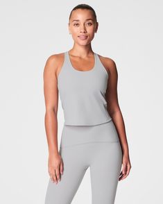 This contour crossback tank top features a built-in shelf bra with an adjustable band for a custom fit. An ideal style for distraction-free downward dogs, it hits at the hip and fits close to the body. | Spanx Women's Get Moving Contour Crossback Shelf Tank Top Downward Dog, Get Moving, Shelf Bra, Custom Fit, The Body, Built In, Tank Top, Tank Tops, Bra