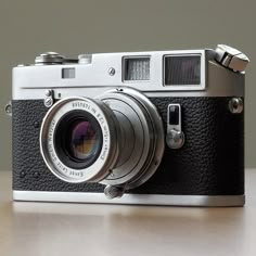 an old camera sitting on top of a table