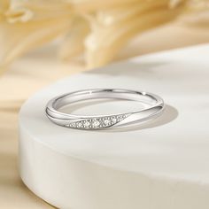 a white gold ring with diamonds on it