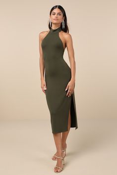 It's easy to see why everyone is swooning over you in the Lulus Simply Enchanted Olive Green Halter Midi Dress! Soft, medium-weight stretchy knit shapes a sleeveless bodice with a halter neckline that secures with button loops above the open back. Bodycon silhouette continues into a flattering skirt that ends at a midi hem with a tasteful side slit. Fit: This garment fits true to size. Length: Mid-calf length. Size medium measures 43.5" from top to bottom. Bust: Great for any cup size. Waist: Fi Midi Halter Dress, Green Halter Dress, Flattering Skirt, Black Tie Wedding Guests, Dress Stretch, Halter Midi Dress, Cotton Dress Summer, Adhesive Bra, Midi Cocktail Dress