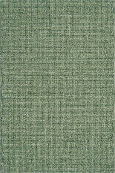 a green rug with small squares on the top and bottom, as well as an area for