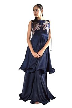 Navy blue pleated tunic featuring floral embroidery on the bodice. Paired with a matching sharara for a complete look., Fit: Relaxed Designer Sleeveless Dresses With Floral Embroidery, Anarkali Dresses With Ruffles, Designer Sleeveless Spring Dresses, Spring Designer Blue Dress, Designer Sleeveless Sharara For Spring, Designer Wear Sleeveless Sharara For Spring, Blue Sleeveless Floral Embroidery Sets, Blue Sleeveless Sets With Floral Embroidery, Designer Sleeveless Silk Dress