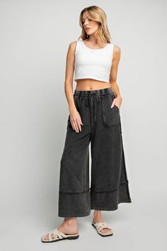 Discover ultimate comfort with our Comfy Wide Lounge Pants. These mineral washed pants feature wide legs for a relaxed fit, perfect for lounging at home or running errands. The drawstring ensures a secure fit, while the terry knit lining adds extra... Comfy Wide Leg Sweatpants For Spring, Comfy Wide-leg Spring Sweatpants, Comfy Wide Leg Cotton Bottoms, Comfy Wide Leg Bottoms With Loosely Fitted Hips, Comfy Cotton Wide Leg Bottoms, Everyday Wide Leg Washed Black Pants, Everyday Wide Leg Drawstring Pants, Wide Leg Washed Black Pants For Everyday, Everyday Wide Leg Pants With Drawstring