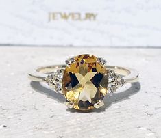 Don't miss this opportunity to own this beautiful gemstone ring crafted in 14k gold filled => Gemstone Type - Citrine, Clear Quartz => Gemstone Cut - Faceted => Gemstone Size - 8*10 mm, 2 mm => Total Number of Gemstones - 7 => Metal Type - 14k Gold Filled (Tarnish Resistant And Nickel Free) - also available in 925 sterling silver * Please contact me for pricing on a sizes larger than 11 * ~ Feel free to ask me about custom made designs. ❏ Replacements and custom orders : ✪ 925 ste Gold Oval Citrine Diamond Ring, Gold Crystal Ring With Gemstone Accents In 14k Gold, Yellow Oval Promise Ring, Citrine Ring With Accent Stones, Gold Oval Rings With Gemstone Accents, Oval Gold Rings With Gemstone Accents, Oval Yellow Gold Topaz Ring With Vvs Clarity, Oval Yellow Gold Diamond Ring With Gemstone Accents, Oval Citrine Gemstone Ring