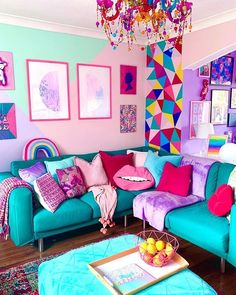 a living room filled with lots of colorful furniture and art on the wall behind it