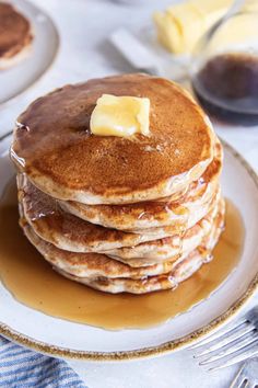 a stack of pancakes with butter on top