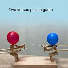 two versus puzzle game with balloons on top of each other and arrows in the middle