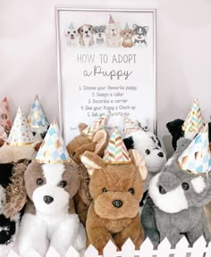 several stuffed animals wearing party hats in front of a sign that says how to adopt a puppy