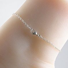 Silver dragonfly anklet made with a lovely and dainty sterling silver dragonfly charm that is suspended on a sterling silver chain with a sterling silver clasp. Choose the size anklet you need from the drop-down menu, bearing in mind that the anklet should be approximately one inch larger than the size of your ankle. The anklet will arrive in an attractive gift box. Adjustable Silver Anklet With Lobster Clasp, Minimalist Silver Anklets With Adjustable Chain, Silver Minimalist Anklets For Gift, Minimalist Sterling Silver Anklet With Adjustable Chain, Adjustable Sterling Silver Anklet, Adjustable Delicate Sterling Silver Bracelet As A Gift, Minimalist Sterling Silver Anklets In Silver, Dainty Sterling Silver Anklets, Adjustable Hypoallergenic Silver Anklet