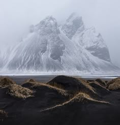 the mountain is covered in snow and sand