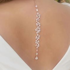 Make a statement on your special day with our exquisite bridal choker backdrop necklace. Crafted with high-quality materials, this piece is designed to elevate your bridal ensemble and add a touch of glamour to your look. Key Features: Made with zinc alloy and adorned with cubic zirconia, rhinestones, and simulated pearls for a luxurious appeal Body chain/back necklace chain material crafted from alloy and cubic zirconia crystal for a dazzling effect Exudes elegance and sophistication, making it Glamorous Silver Backdrop Necklace For Wedding, Glamorous Backdrop Necklace For Weddings, Delicate Dangle Backdrop Necklace For Wedding, Back Necklace Wedding, Bridal Backdrop Necklace, Back Accessories, Backdrop Necklace, 2024 Jewelry, Backdrops Necklace